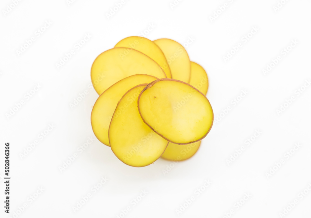 potato round slice over on white background, top view