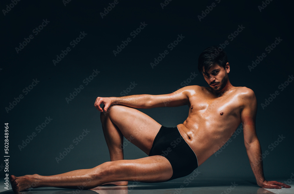 Handsome sexy naked macho wearing black underwear Handsome sexy naked macho wearing black underwear