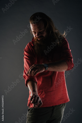 Beautiful strong nordic man with stylish hairstyle and beard on a isolated background.