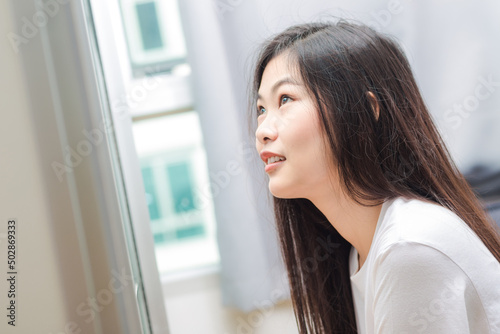 Free Download Beautiful smiling asian women relaxing in cozy room - GFXLoad