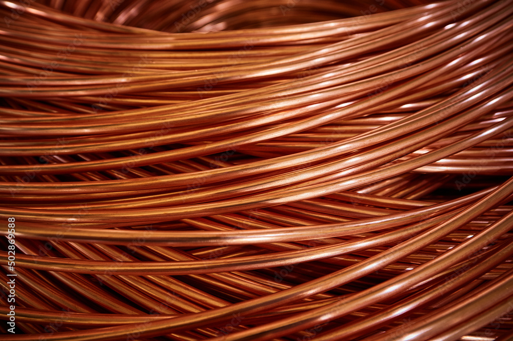 Shiny winded copper cable in warehouse of production plant