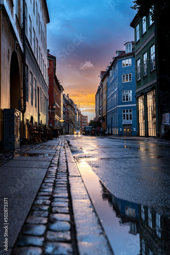 Beautiful sunset on a european narrow street in Copenhagen  Denmark 