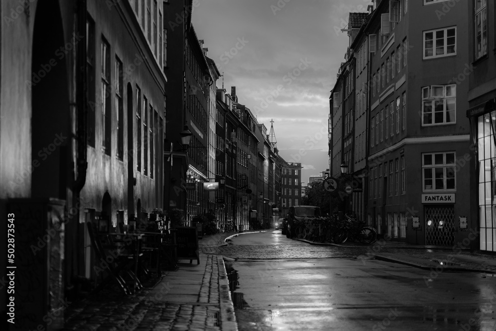 Fototapeta premium Beautiful sunset on a european narrow street in Copenhagen, Denmark 