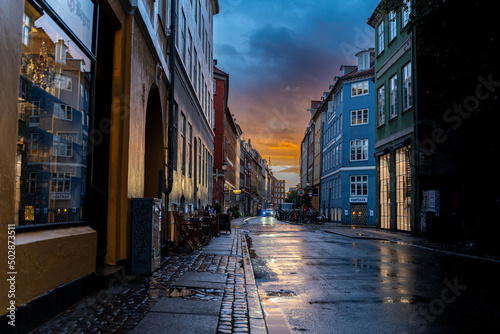 Beautiful sunset on a european narrow street in Copenhagen  Denmark 