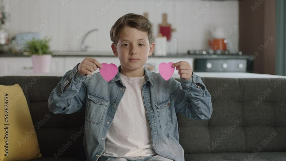 Boy Send Msg Child celebrating with the crafts he learned at school.Cute little boy ...