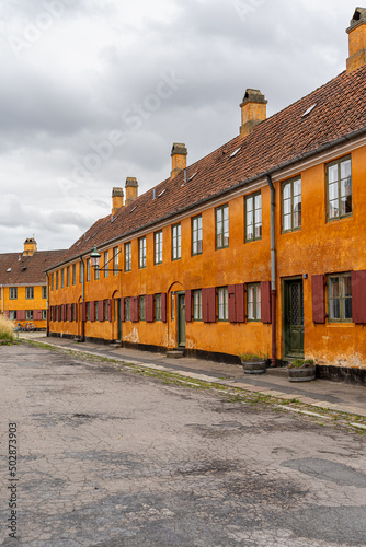 Beautiful view of the Old orange houses in the famous Nyboder district. Copenhagen. Denmark