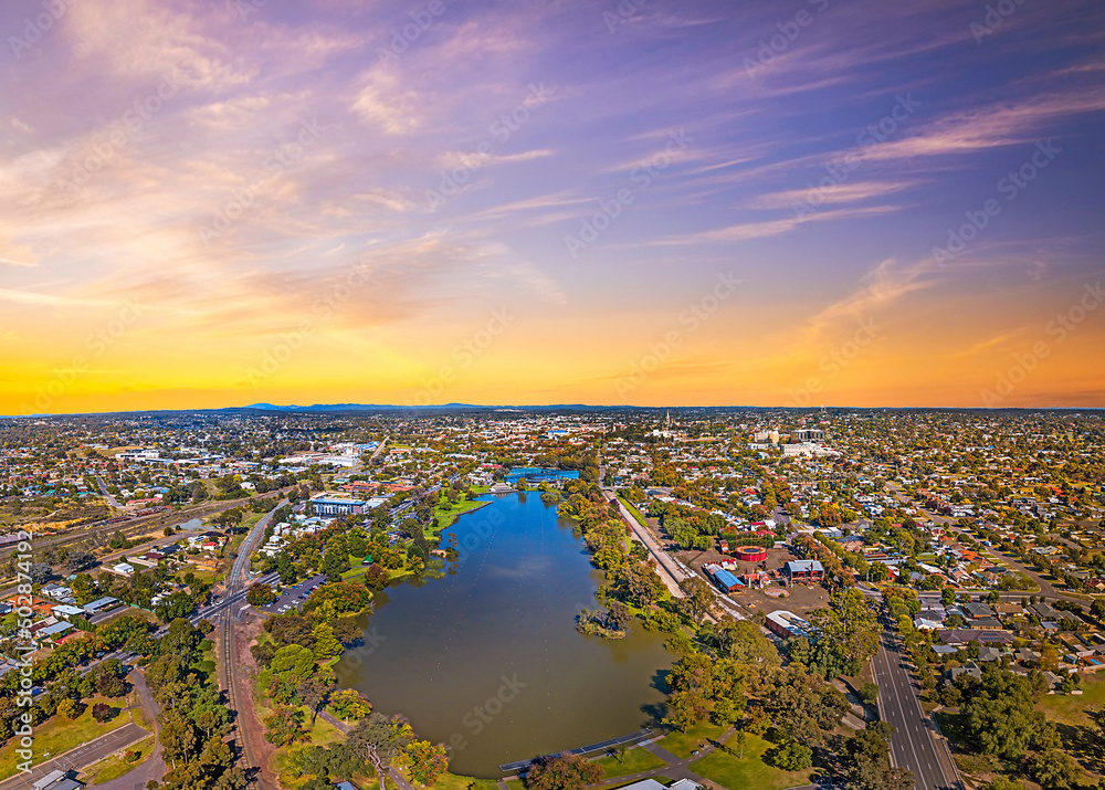 Aerial view of Lake Weeroona Bendigo. Sunrise sunset morning evening flight with spectacular views of red purple and blue skies and the Central Victoria Australia landscape.