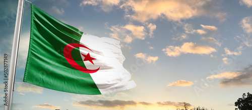 Algeria national flag cloth fabric waving on the sky - Image