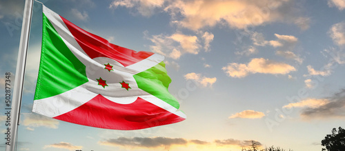 Burundi national flag cloth fabric waving on the sky - Image photo