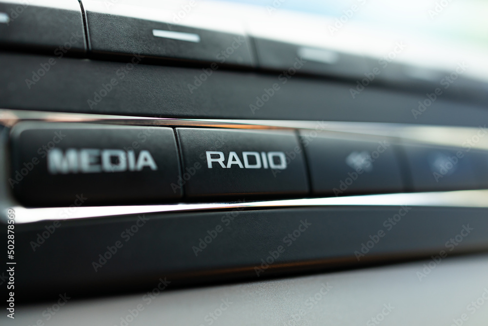car audio media control panel. macro. auto sound repair service. radio button close up car audio media control panel. macro. auto sound repair service. radio button close up