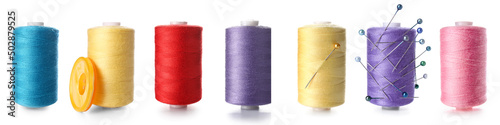Set of sewing threads on white background photo