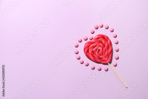 Wallpaper Mural Lollipop in shape of heart and candies on color background Torontodigital.ca