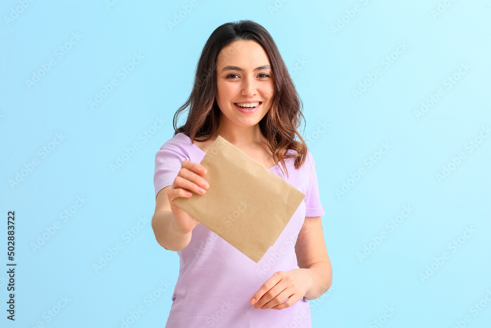 Young woman with envelope on color background Young woman with envelope on color background