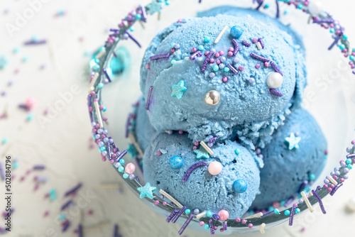 Blue ice cream with sugar sprinkles close-up.