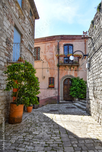 A narrow street between the old houses of Morcone  a village in the province of Benevento  Italy.