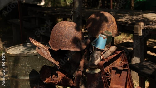 Military rusty metal parts. Elements of world war 2 a lot of destroyed things after battle and the influence of time. Soldiers personal belongings photo