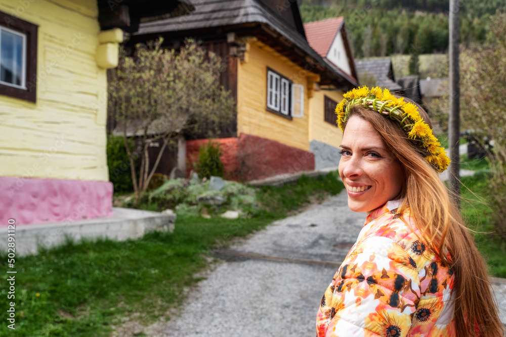 Pretty face girl posing in old historical village Vlkolinec at Slovakia