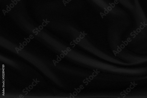 Smooth elegant black silk fabric or satin luxury cloth texture can use as wedding background. for drapery luxurious abstract design