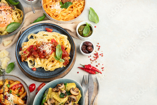 Italian pasta assortment on light background.