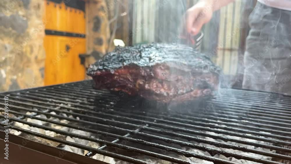 slow motion scene of meat being grilled