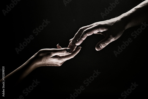 Hands at the time of rescue. Friendly handshake, friends greeting, teamwork, friendship. Tenderness, tendet touch.
