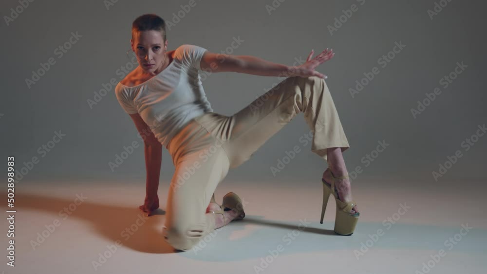 Passionate dancing young girl perform contemporary femme dance in studio. Flexible sexy female dancer on floor. ProRes