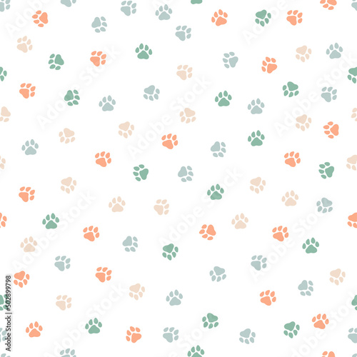 Seamless pattern with colorful dog paws. Cute and childish design for fabric, textile, wallpaper, bedding, swaddles toys or gender-neutral apparel.