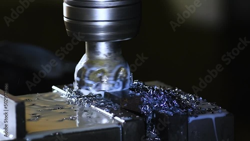 Close-up industrial metalworking cutting automation process by milling CNC.Micro machining process , Coolant and lubrication.Close up of CNC machine at work. photo