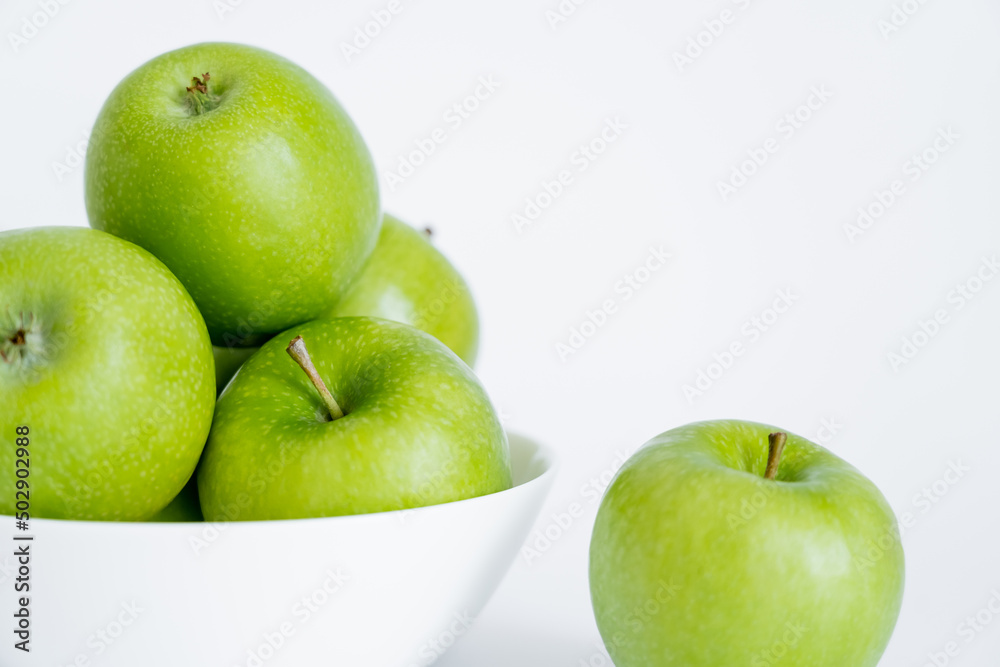 bowl with ripe and fresh apples on white. bowl with ripe and fresh apples on white.