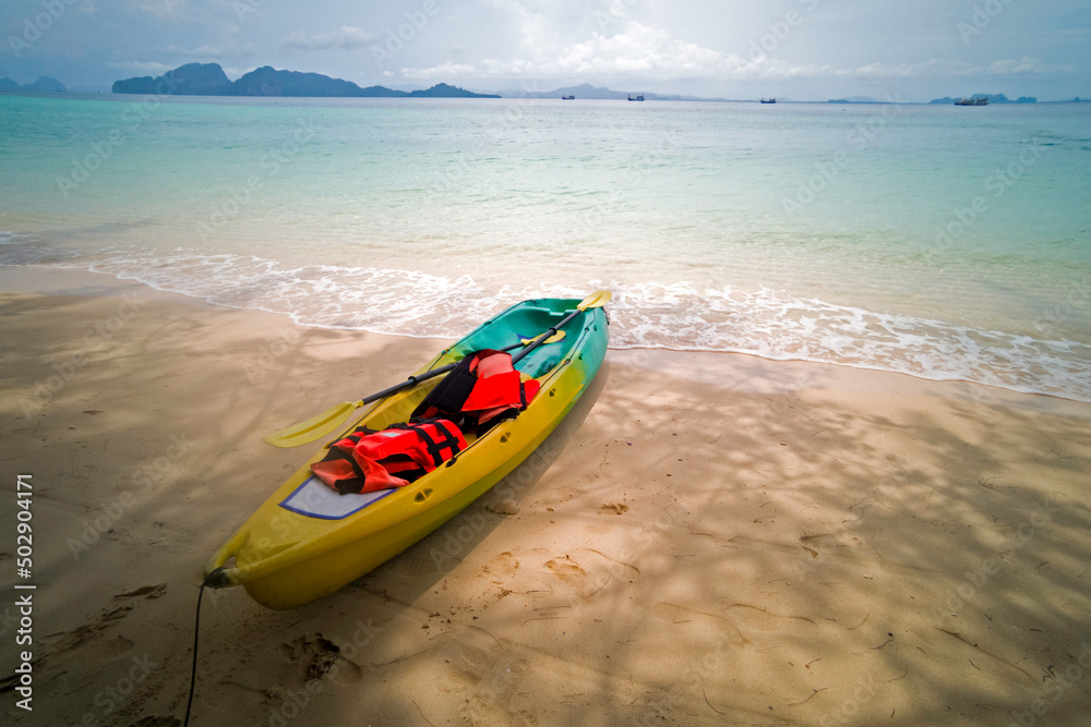 Life jackets on kayaks on the sea during the day. Life jackets on kayaks on the sea during the day.