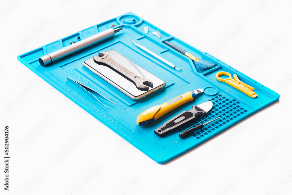 Flat lay image of dismantling the broken smart phone for preparing to repair or replace some components, Top view