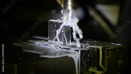 Close-up industrial metalworking cutting automation process by milling CNC.Micro machining process , Coolant and lubrication.Close up of CNC machine at work.