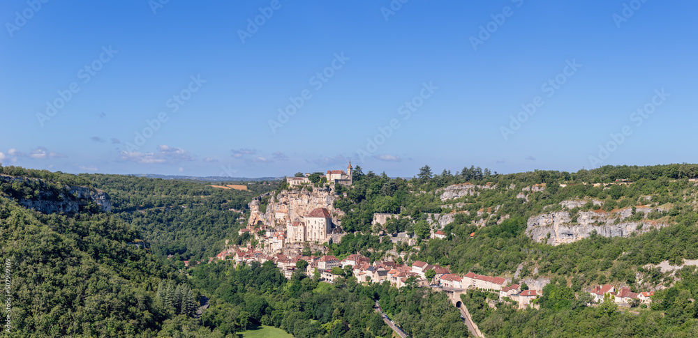 Geology and geography of surroundings of Rocamadour holy village, gorge of Alzou river on clear sunny morning. Lot, Occitania, Southwestern France