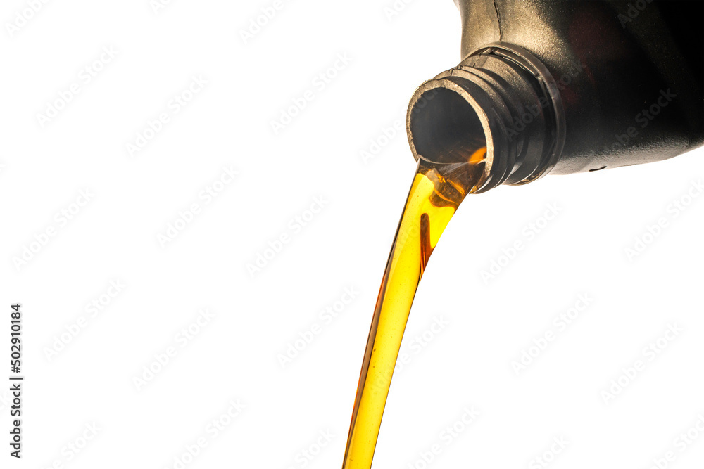 Car lubricant flows from gray bottle on isolated white background. Car lubricant flows from gray bottle on isolated white background.