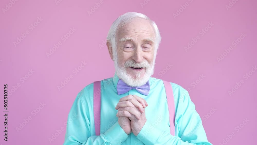 Stylish aged man impressed present party isolated pastel color background Stylish aged man impressed present party isolated pastel color background