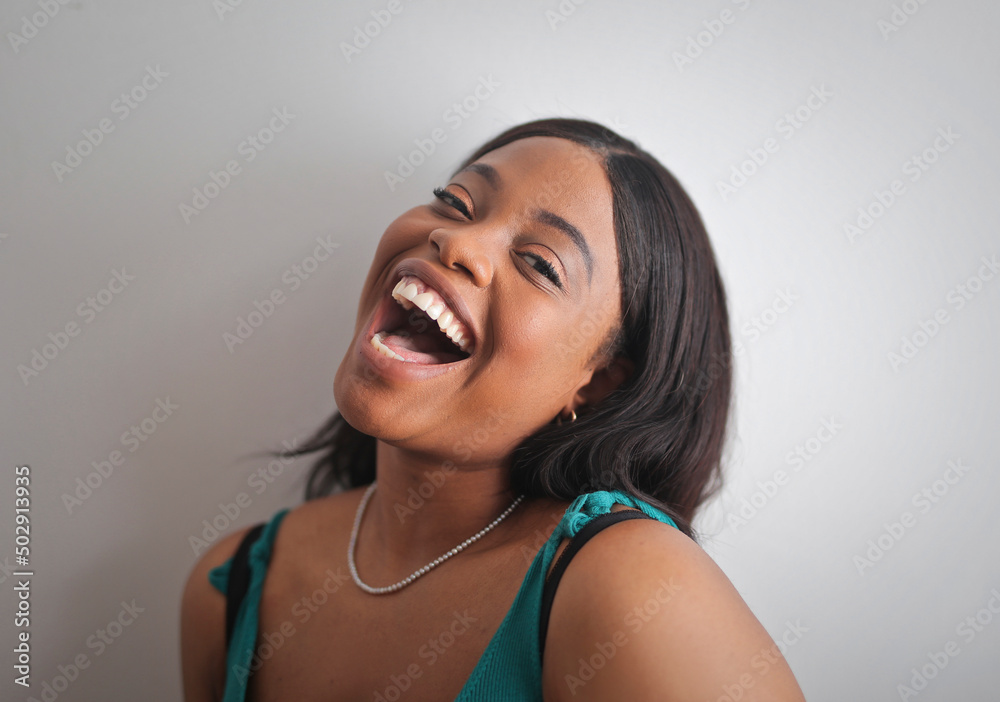 portrait of a young laughing woman portrait of a young laughing woman