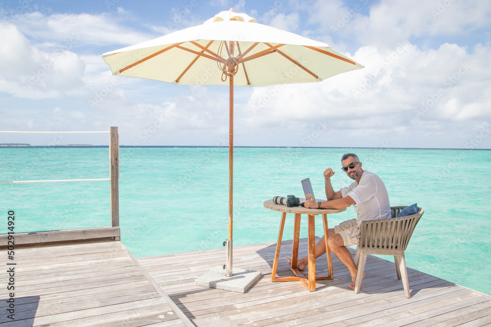 blogger at work in Maldives in a sunny day