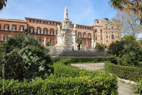 baroque fountain (marble theater) and norman palace (actual parliament) in palermo in sicily (italy)