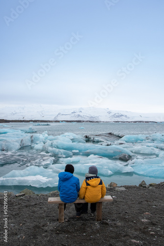 kids looking at a glacier lake in iceland