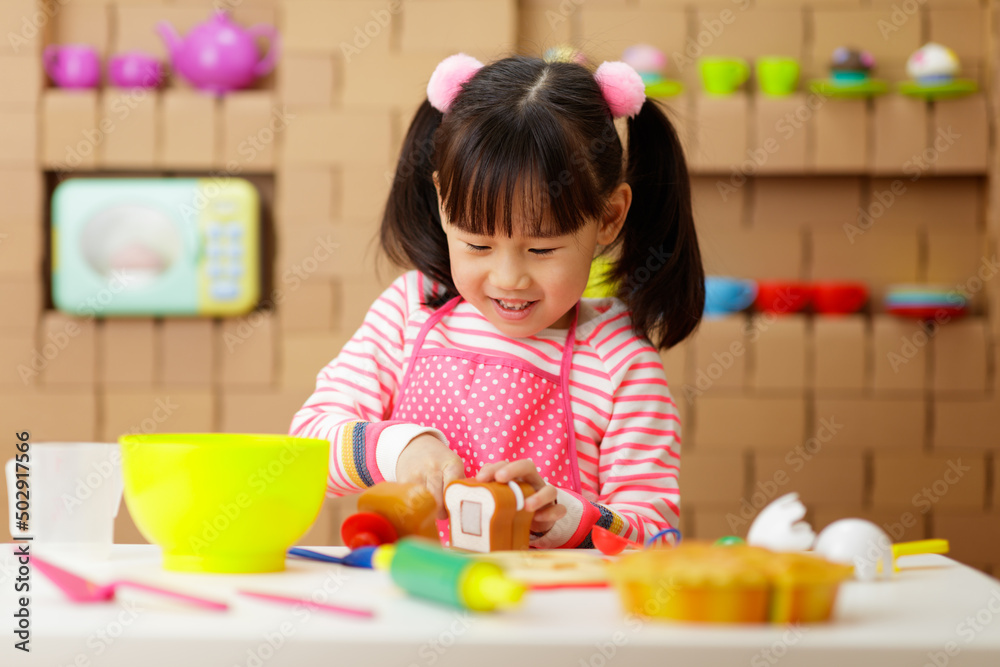 young girl pretend playing food preparing at home young girl pretend playing food preparing at home