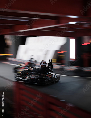 Electric Go kart speed race with two drivers in a indoor circuit race