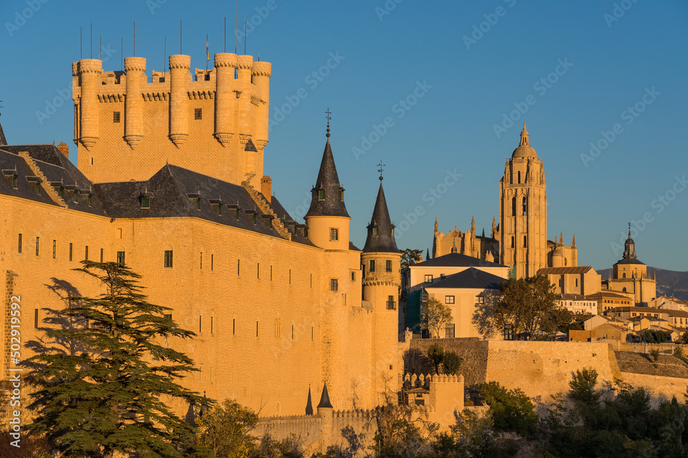 View of the Alcazar fortress and St Mary cathedral of segovia at sunset, listed world Heritage centre by UNESCO