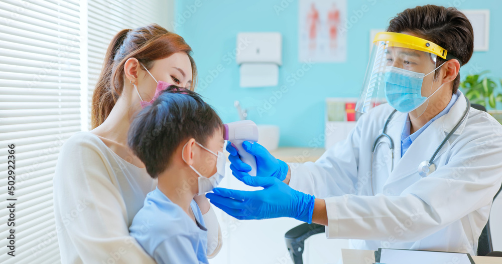 pediatrician examining sick boy pediatrician examining sick boy