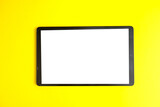 Tablet pc on yellow background