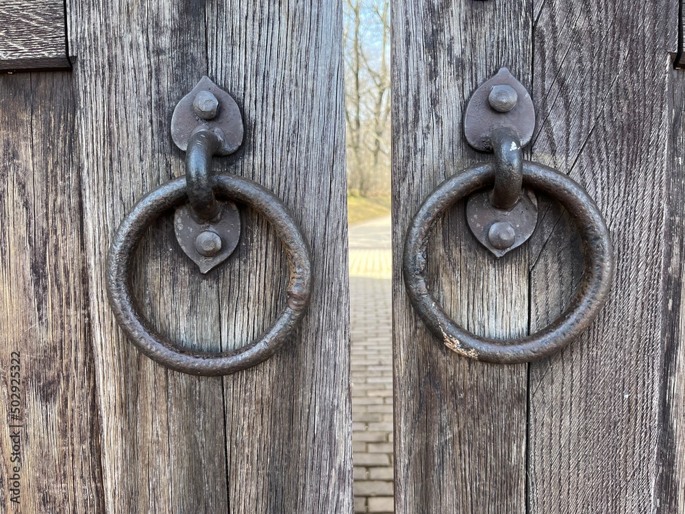 Old door handles on the wooden door Old door handles on the wooden door