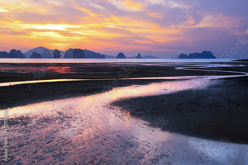 Thailand. Travel and tourism background with traditional water lagoon with sunset cloudy sky.