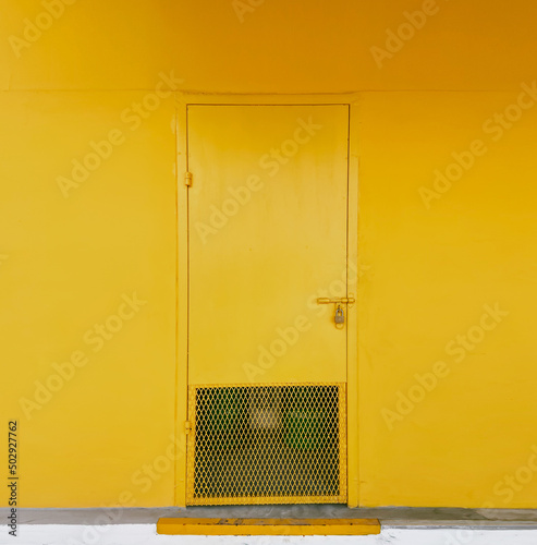 yellow door in the wall