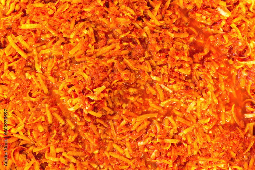 Adjika - aromatic mass of sweet red peppers, red hot chili peppers, carrots, garlic and various seasonings. Adjika - aromatic mass of sweet red peppers, red hot chili peppers, carrots, garlic and various seasonings.