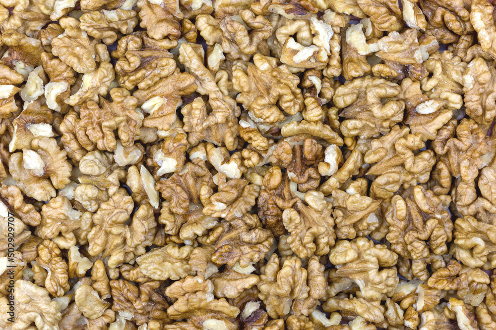 Many walnut kernels as background, texture, pattern. Many walnut kernels as background, texture, pattern.