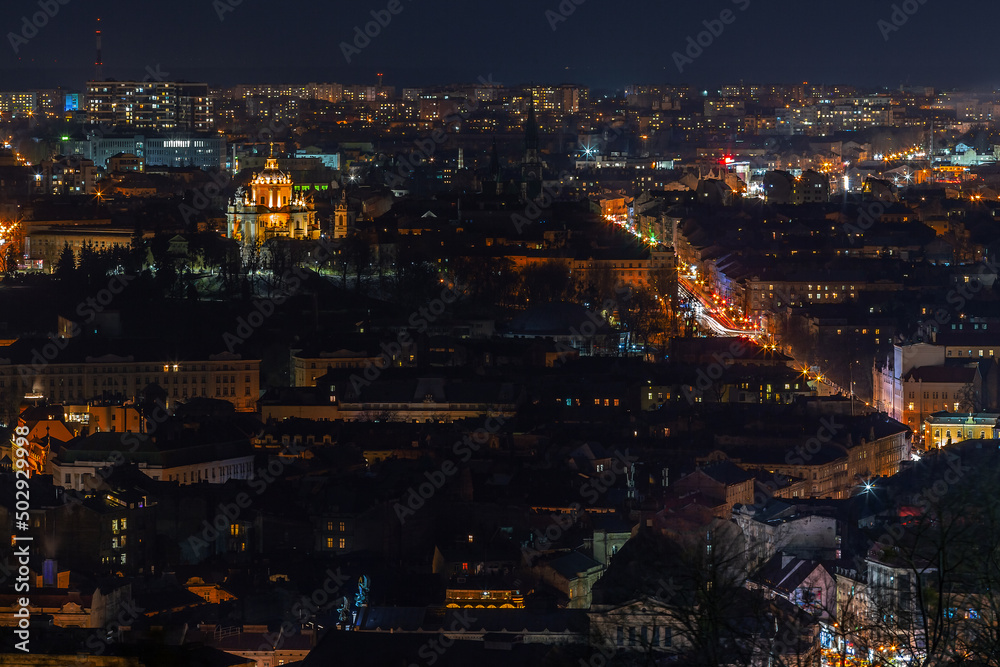 The night city was photographed with a long exposure.